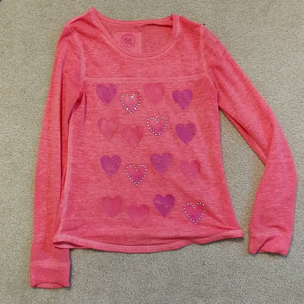 A pink long sleeve shirt